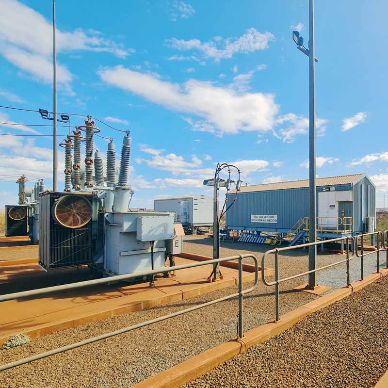 HV switchyard transformer and switch room at an NPI Inland substation in the Pilbara