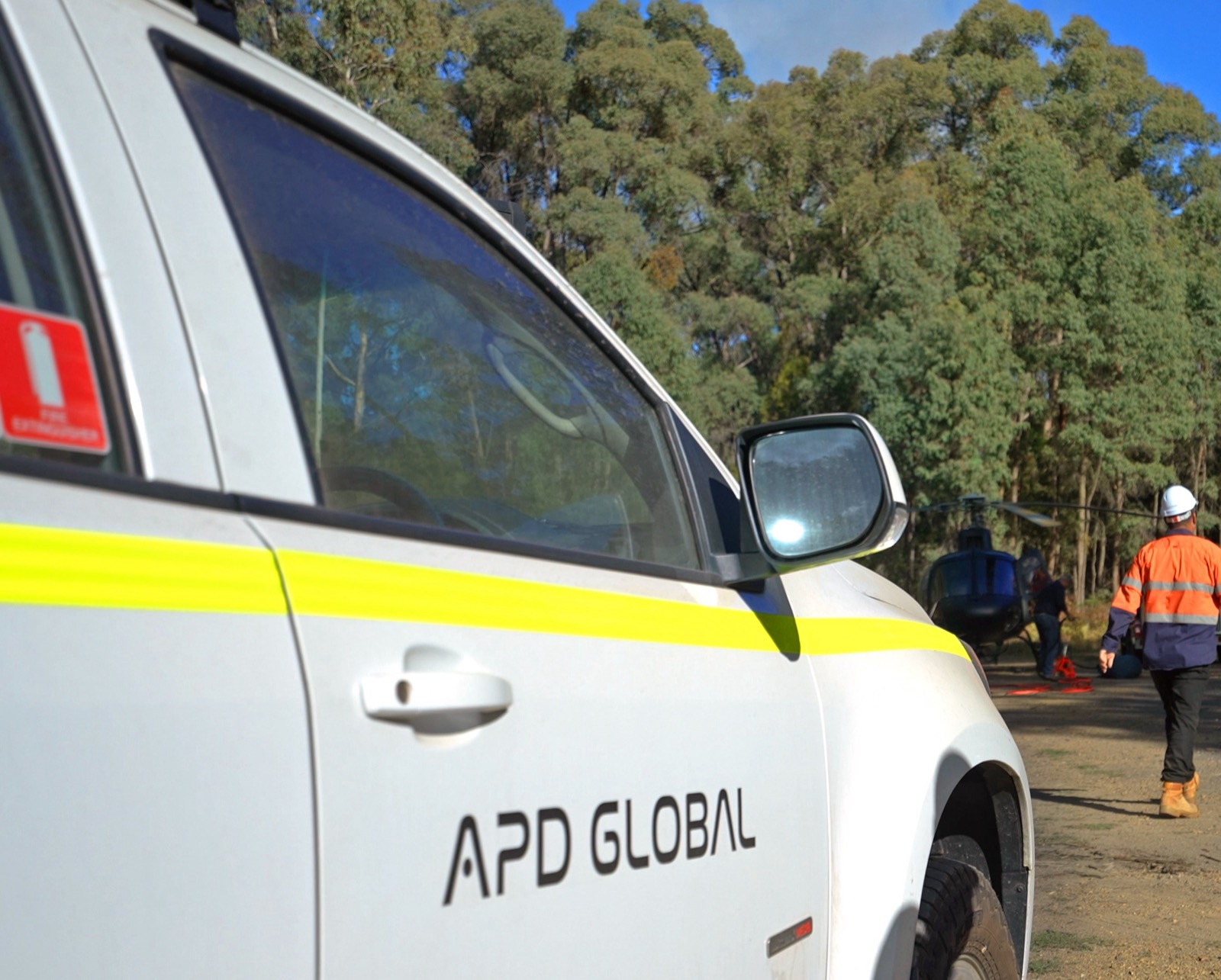 APD Global ute and helicopter delivering equipment to a remote radio site