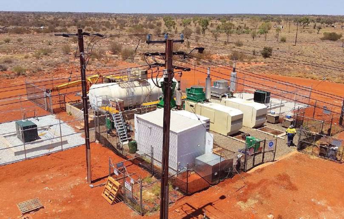 Aerial view of a remote off-grid power station compound with generation, fuel storage and switchgear