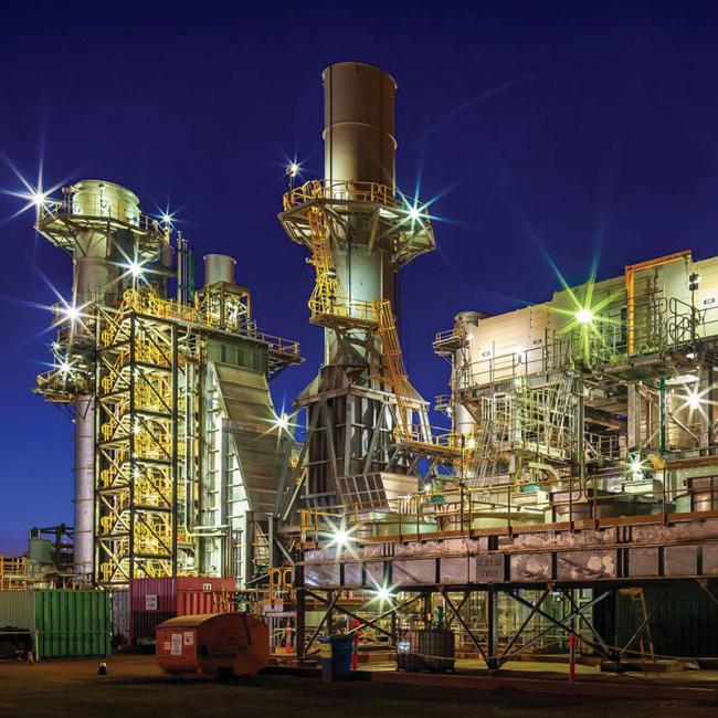 Power station generation plant at night, subject of the load management control system upgrade