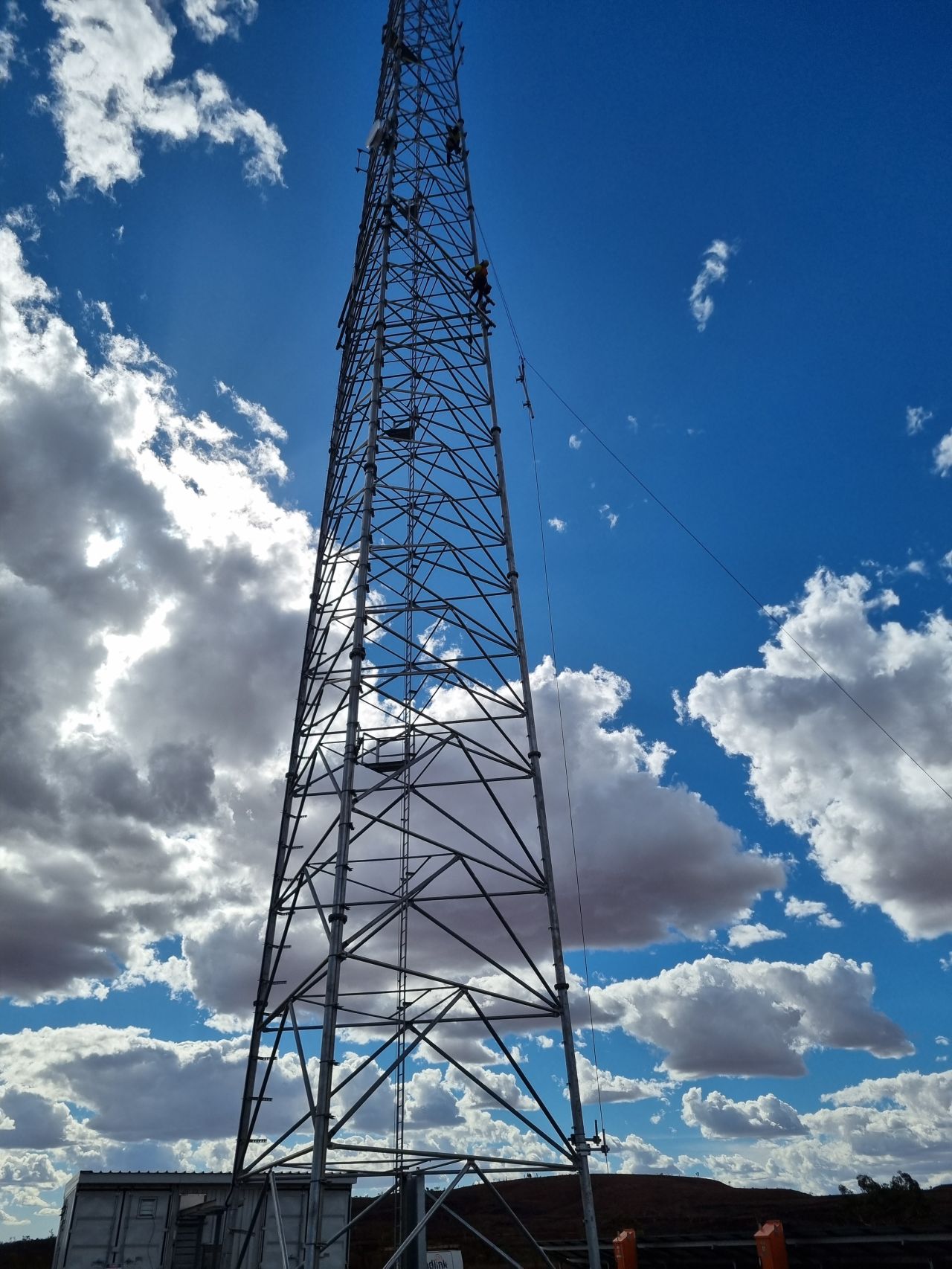 Tower climb on a mining communications mast